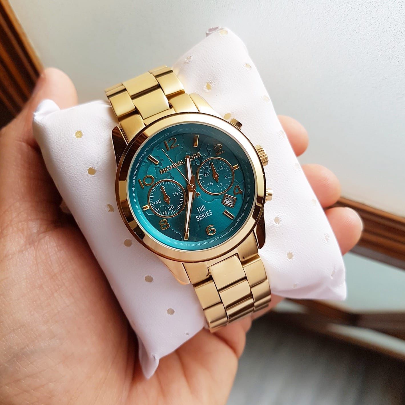 Michael Kors MK5815 watch with a PVD gold plated case and turquoise coloured dial maurya watch