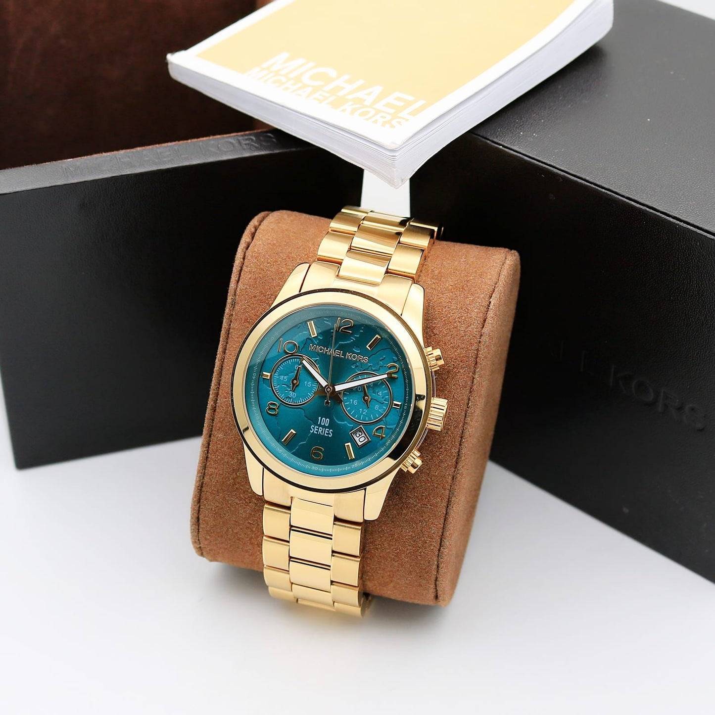 Michael Kors MK5815 watch with a PVD gold plated case and turquoise coloured dial maurya watch
