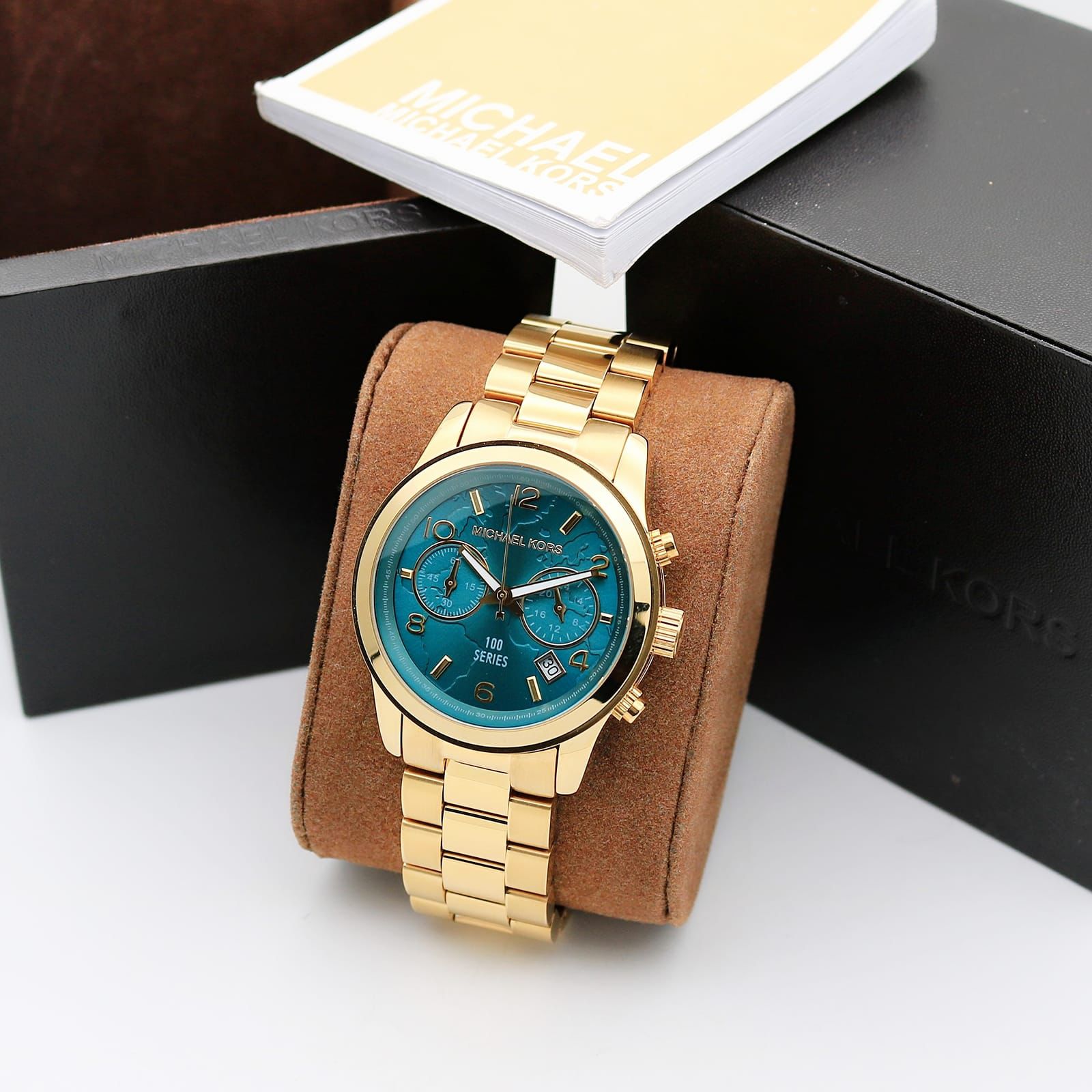 Michael Kors MK5815 watch with a PVD gold plated case and turquoise coloured dial maurya watch