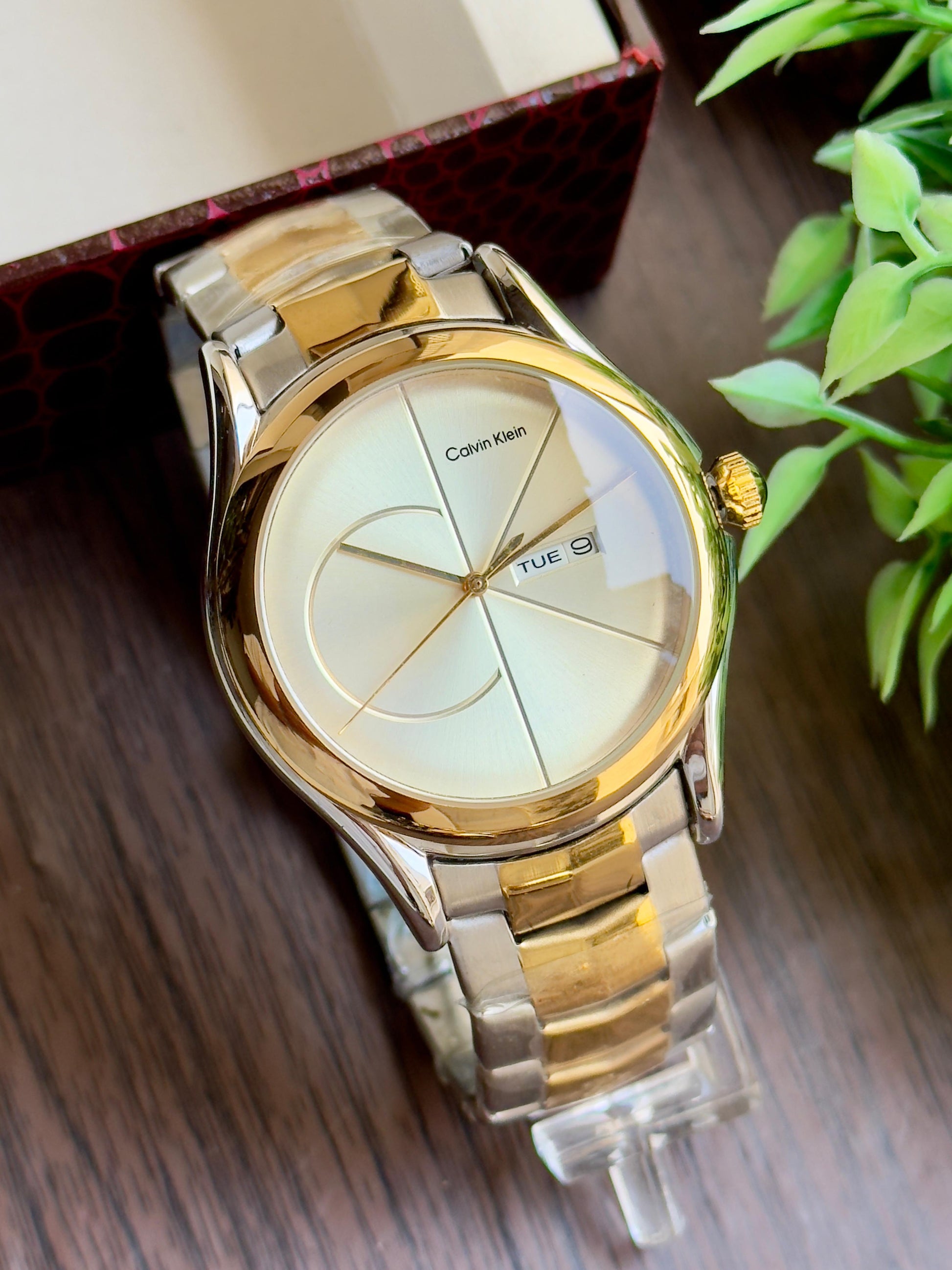 CK luxurious gold finish and sleek minimalist design. maurya watch