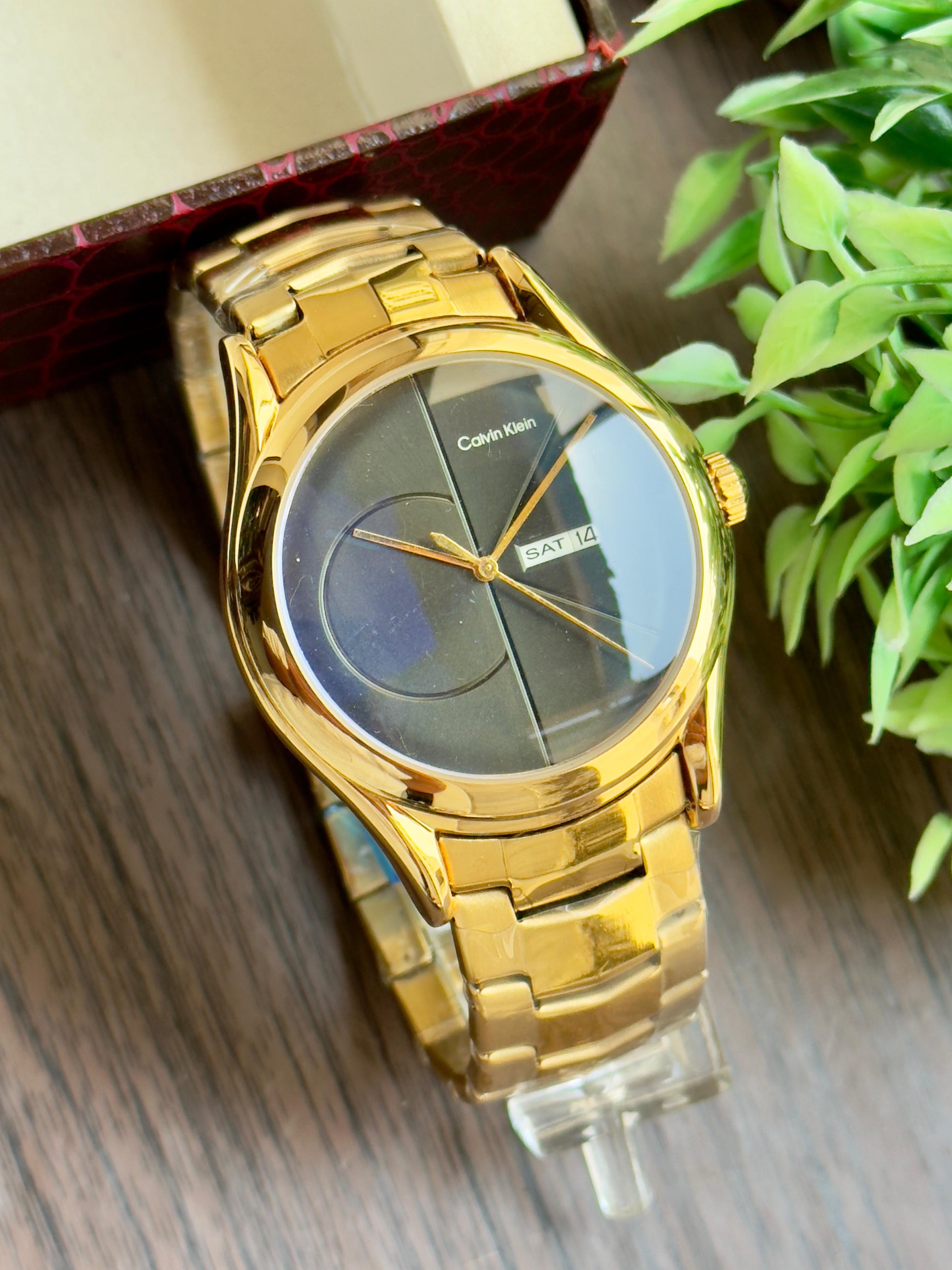 CK luxurious gold finish and sleek minimalist design. maurya watch